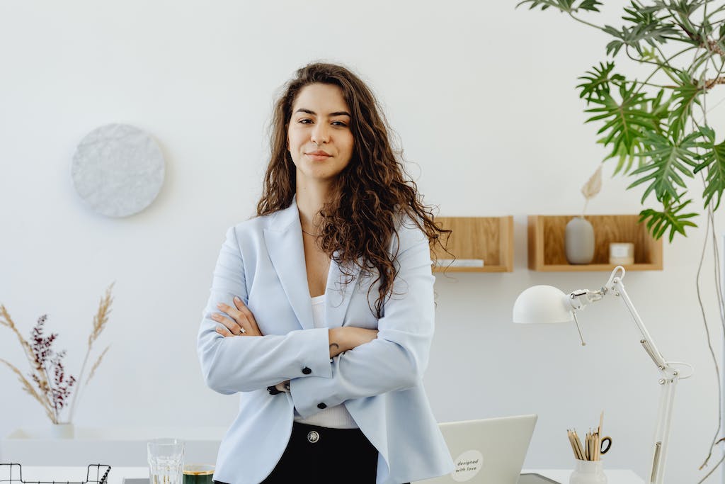 Woman In Sky Blue Blazer Standing Near White Wall 8528741 1024x683